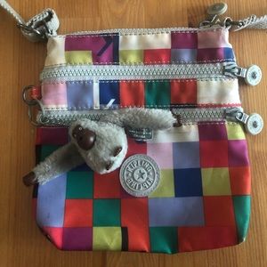 Kipling 4 pocket Cross-Body With Iconic Monkey
